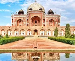 Humayun's Tomb in Delhi: red sandstone mausoleum with a large central white dome, arches, and formal gardens with a reflecting pool.